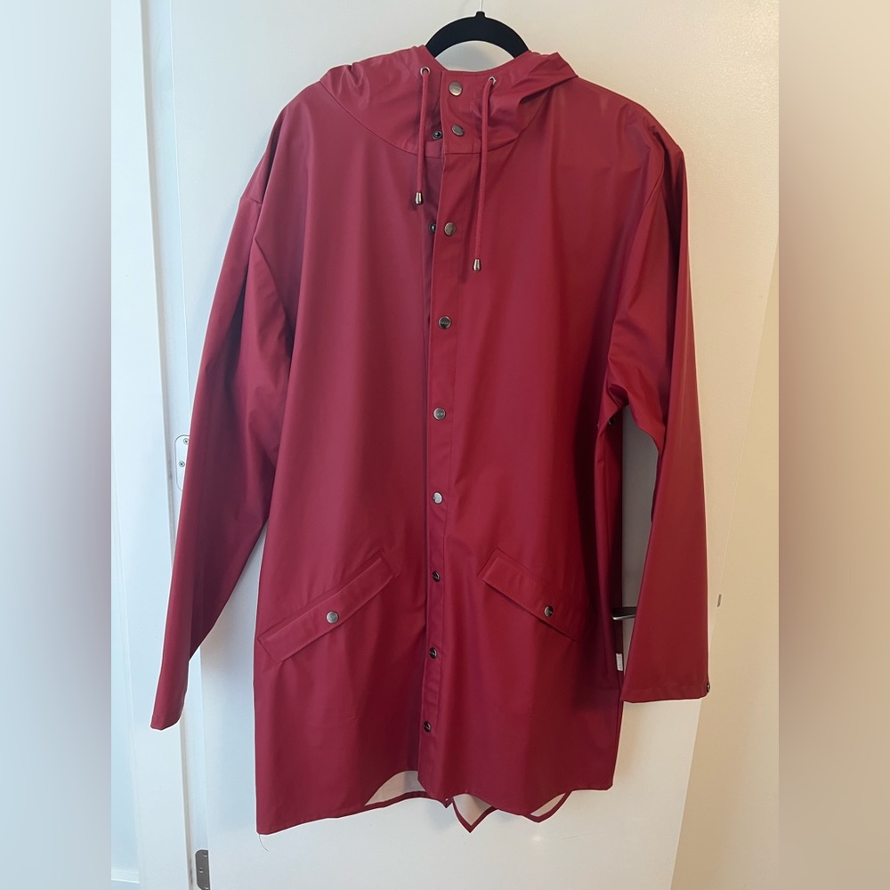 RAINS Mens L/XL long rain jacket, red. Light weather spotting inside hood.